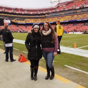 Sara Biancosino '17, at left, standing on FedExField with a friend