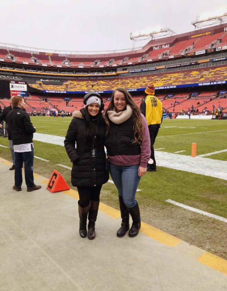 Sara Biancosino '17, at left, standing on FedExField with a friend