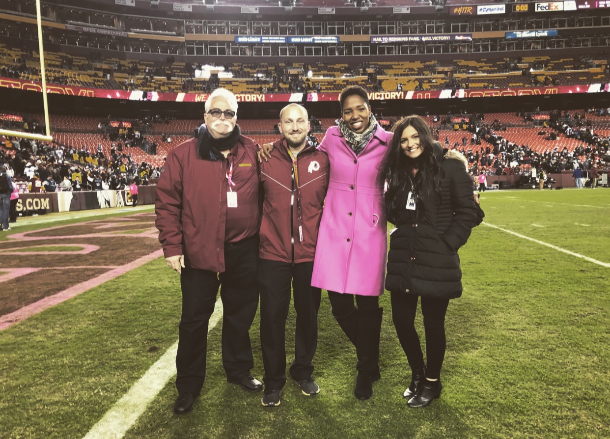 Sara Biancosino '17, far right, standing with three others on on FedExField.