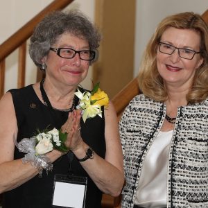 Saint Rose alum Sharon Maneri receiving an award from President Carolyn J. Stefanco