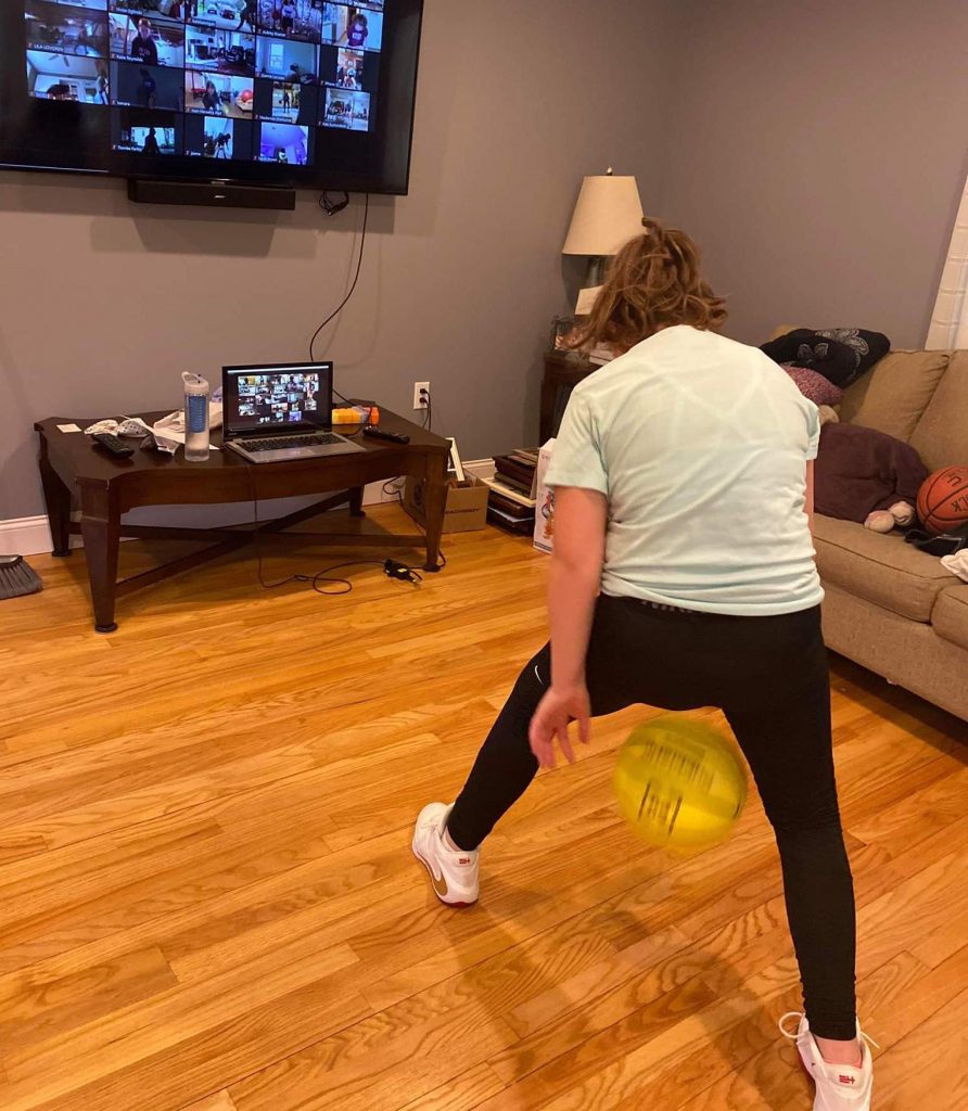 girl doing Tay Fisher's basketball lessons online at home