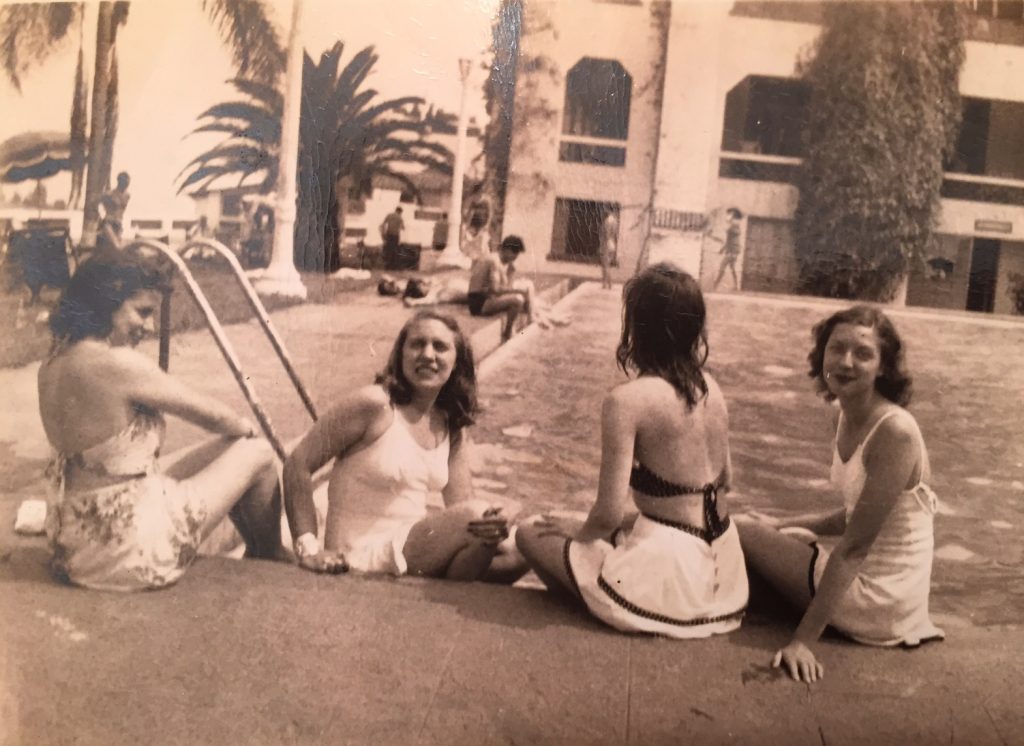 The "Five American Girls" sitting poolside in 1945 