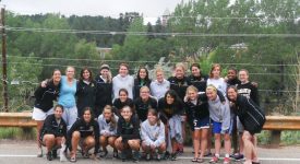 2011 Saint Rose women's soccer team posing alongside the road